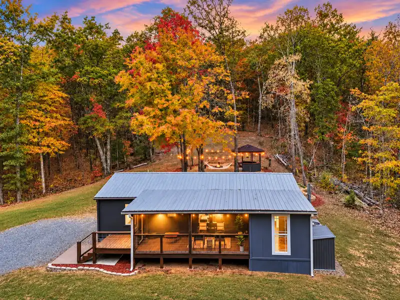 Exterior of Casita on the Ridge surrounded by fall foliage on a private wooded ridge in Blue Ridge, Georgia