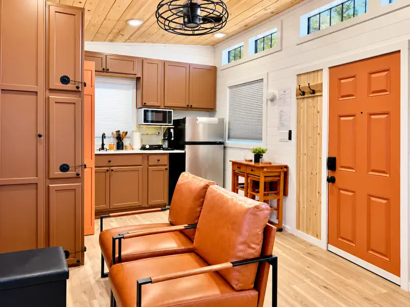 Studio interior with seating and kitchenette at Tiny on the Ridge